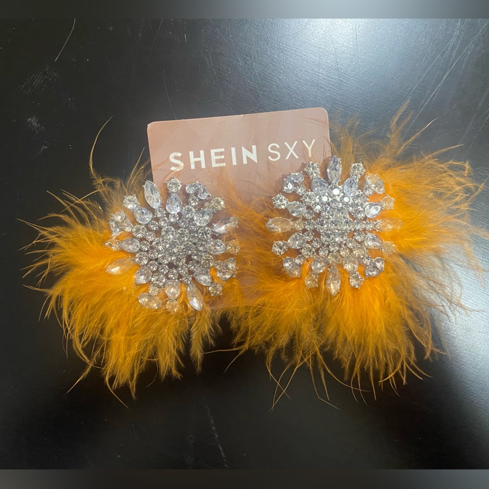 Orange sparkly feather earrings
